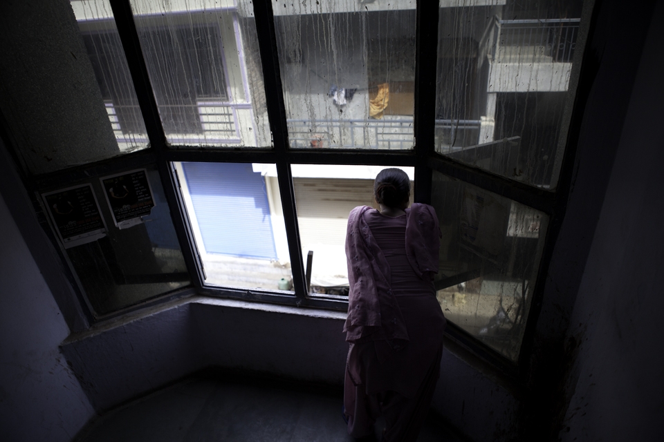 A doctor at an AIDS clinic takes a moment to try to capture a breeze after power to the building cuts out again. The dirty windows and back street location belies the dedication, care and love the staff exhibit to their patients - patients who are all extremely poor, marginalised, and ridiculed. In this clinic the patients are treated like humans, giving them a dignity and a sense of hope they would otherwise never have seen.