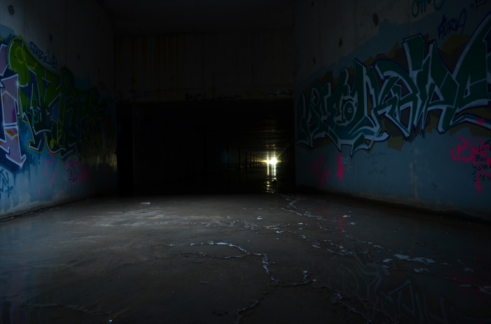 With the booming sounds of traffic and city life above. This small section of light and art gives a reprieve from the darkness before marching onwards towards the pitch black.