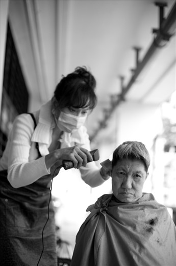 Neither kin nor kith to the residents of the elderly home, this lady comes by once a month to offer them free haircut. She’s been doing it for the past 10 over years but come 2015, she will no longer be needed as the whole area is slated for demolishment to pave way for a new expressway cutting right through the estate.           “What’s going to happen to the home and the residents”, I asked. She said she didn’t know.