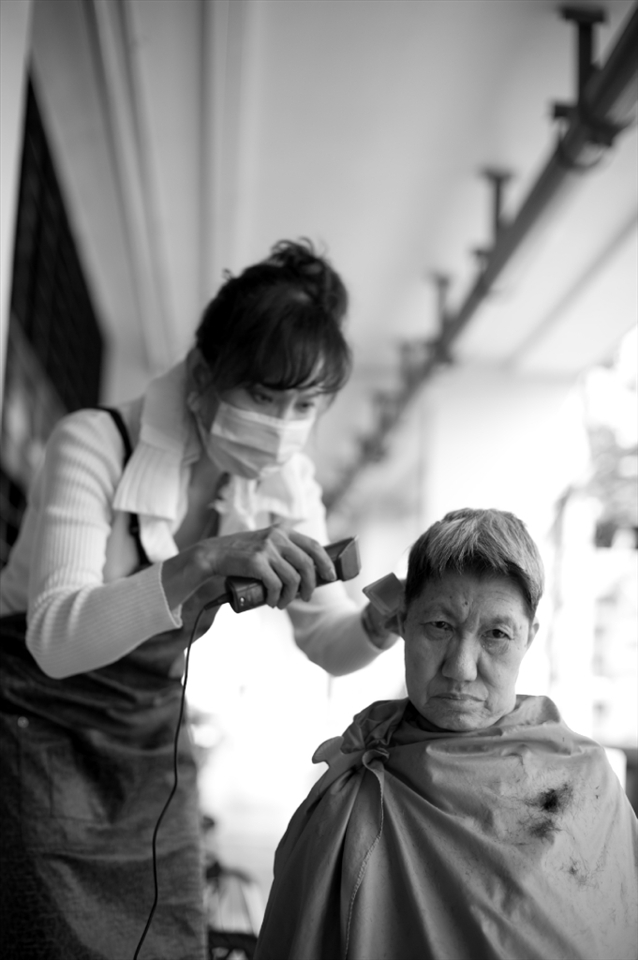 Neither kin nor kith to the residents of the elderly home, this lady comes by once a month to offer them free haircut. She’s been doing it for the past 10 over years but come 2015, she will no longer be needed as the whole area is slated for demolishment to pave way for a new expressway cutting right through the estate.           “What’s going to happen to the home and the residents”, I asked. She said she didn’t know.