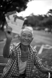 En-route to a political rally just days before the general election, this old gentleman paused for a brief moment at a traffic junction and proudly showed off flyers from the opposition party. There is a sense of hope from his weary smile, a hope for change in a country so obsessed with economic progress that many were left behind in more ways than one. I share the same hope as him as this place I grew up in is now a stranger to me. This place I call home. This island called Singapore. : by chrispy, Views[461]