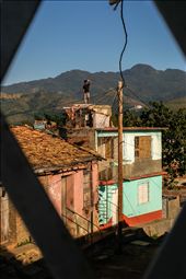 Is the rain coming?: During the late afternoon in the coastal town of Santiago de Cuba, a young man is sent to check on the pending thunderstorms that have been forecasted. Using local knowledge he scours the horizon for any sign of rain.: by christanphotography, Views[599]