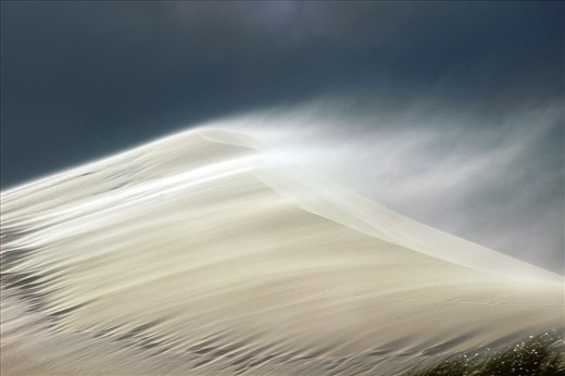 A storm turns sand mounds into hundreds of small bullets.
