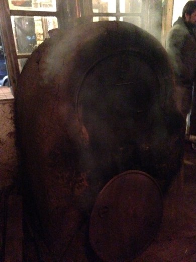 wood-fired oven made of gasoline barrels (i think?) at Allantu, making pizza!