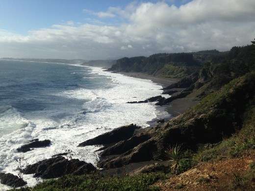 Looking at his beach from the cliff, toward his house (on the cliff opposite of the one we were on).