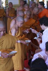 4) Novice monks form a long moving line, making their way through the throng of well wishers. They modestly bow and avert looking into the eyes of the donor, as they accept money that will aid them in their future, minimalistic existence.  
: by chros, Views[302]