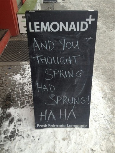 A sign out the front of a cafe near the apartment. 