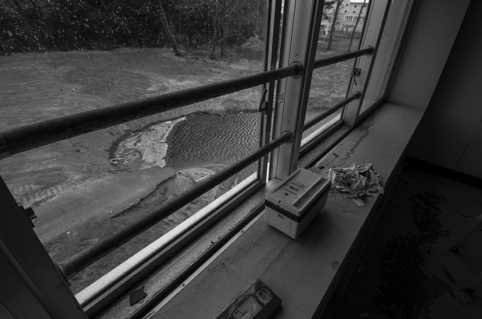 Three sides of the school have been seriously compromised structurally by sinkholes caused by the earthquake and extreme saturation from the tsunami.  In this view from a second floor classroom you can see the remains of the road that at one time went from the front of the school to the rear parking lots.