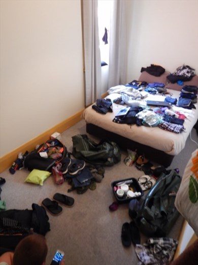 Organising clothes in Bathurst motel room