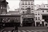 A woman races past Paris's iconic Moulin Rouge without even stopping to give it a glance.: by claires, Views[314]