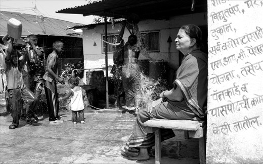 A family joyfully plays with water to celebrate 'Holi' festival in Paud. Maharastra is currently facing the worst drought in more than four decades. Low rainfall results in hunger, shortages of drinking water and limitations for growing crops and maintaining livestock. Using water scarcely has become of crucial importance, yet an exception can be made when it comes to something as vital as their cultural practices. 