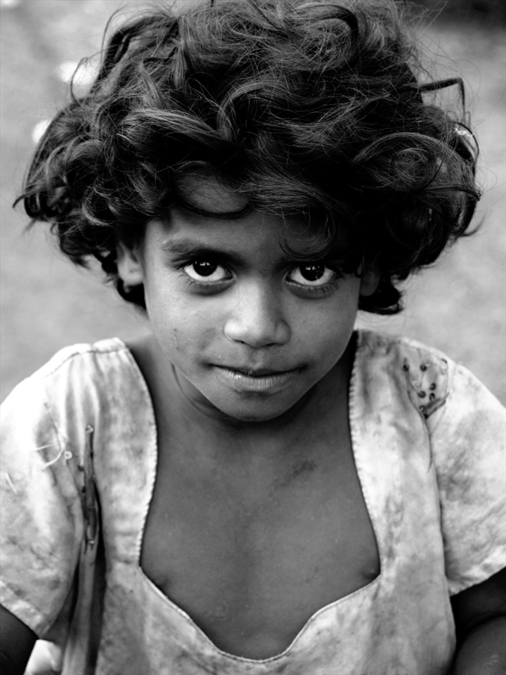 This young girl from the streets of Paud village seems to be challenging the camera; as if she was daring the viewer to taste a sample of her life. 