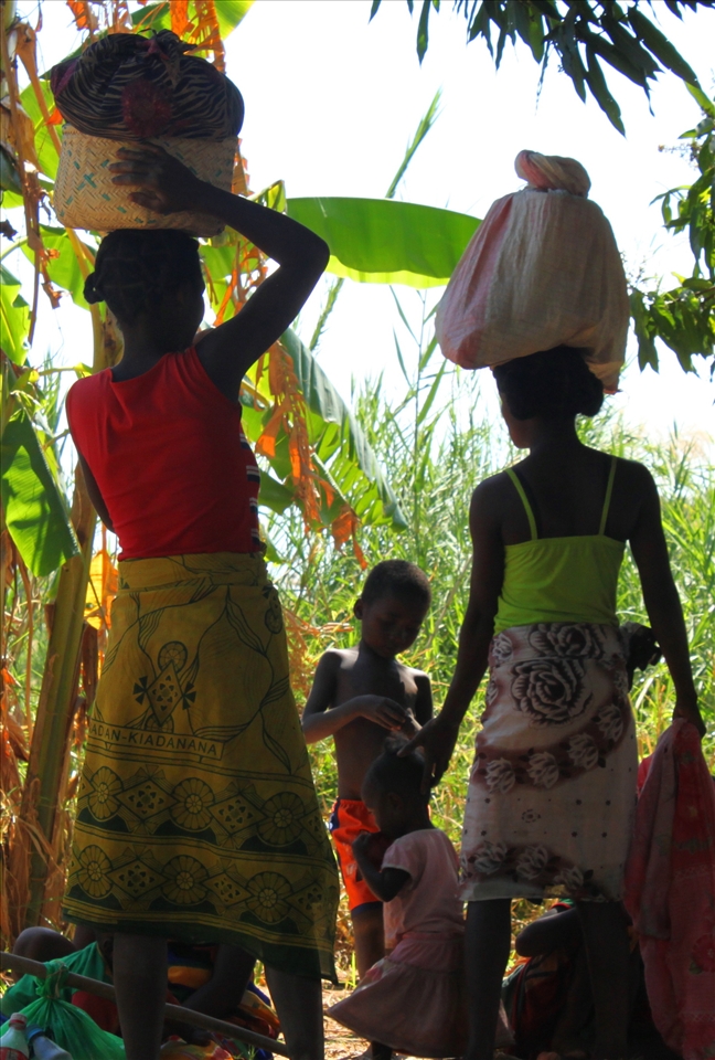 We stopped to make along the Tsiribihina river and these people were resting. They looked so much a part of their surroundings as the colour of their clothes reflected the foliage round them. The children came over to play with us and were content with simple games and their own curiosity.