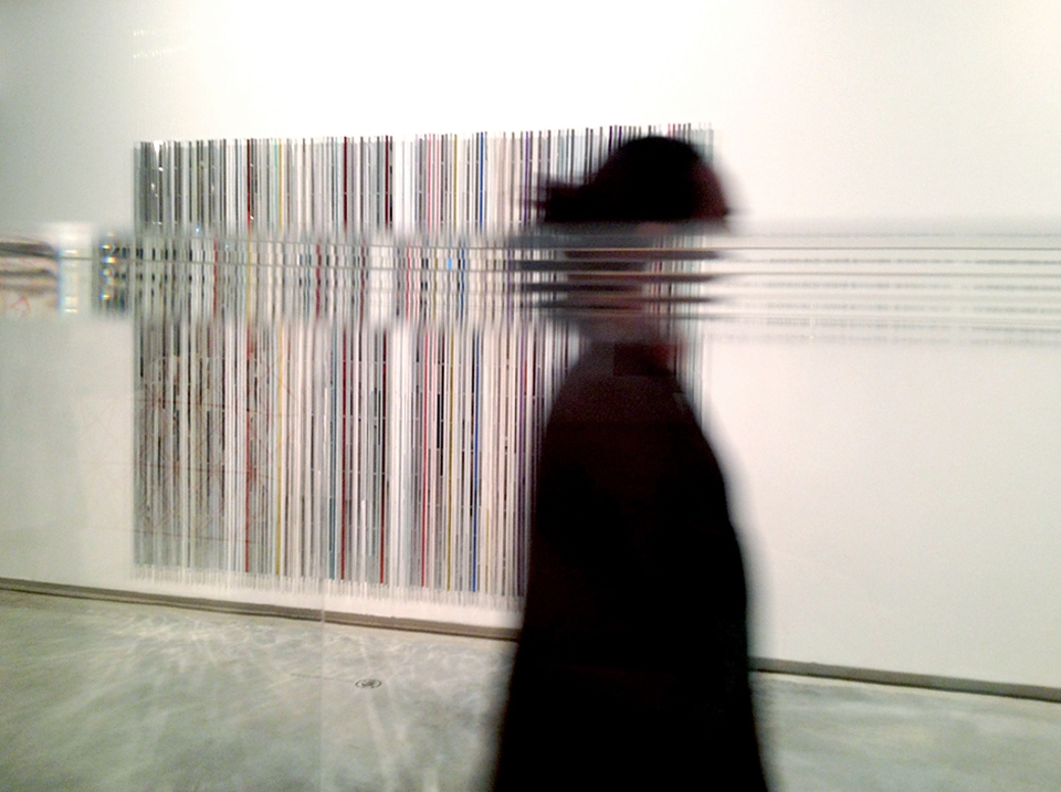 (2) In the Museum of Contemporary Art in Sydney, a nearby glass exhibition case creates a horizontal distortion of  Nick Savvas’ vertical artwork “Showtime 1999”, when a MCA guest walks by.  In a gentle wink to the viewer, I was playing with the idea of making art with art. There is Savvas’ work and then there is my addition to it, which can add to or alter the original meaning. A very contemporary idea.

Ideas about how we make and record art, who is the author of the works we create and how globalisation and technology change the way we communicate with each other, are all playing out in everyday life.  
(This photo was taken with an iPhone)