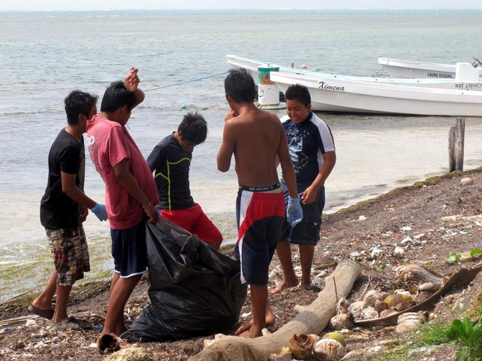 Even a place as remote as Xcalak can't be completely protected from human pollution and litter clogs the coastline. Here the local children are attempting to make a difference. After learning about the damage litter causes, the children were excited to join my colleagues and I in removing as much as we could.
