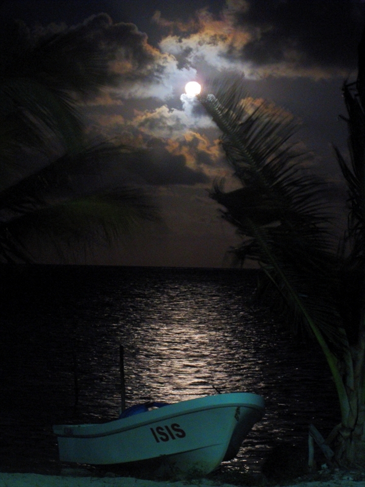 The full moon illuminates a local fishing boat. Xcalak Marine Park was founded by the local fishermen in order to ensure the sustainability of their fishing grounds.