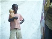 A boy lovingly cradles a doll at a memorial service for the 2010 earthquake.: by clevis, Views[202]