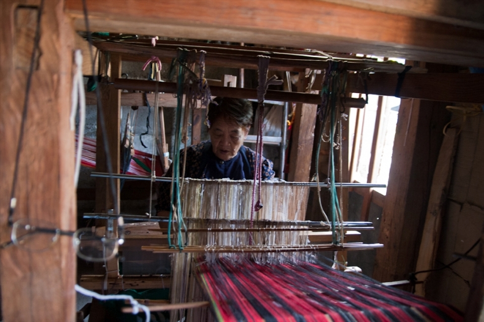 Lola Rose, one of the oldest weavers in Tadian, is famous for making woven clothes.
