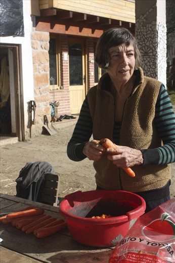 Kind and patient Marleen preparing the carrots for the donkeys