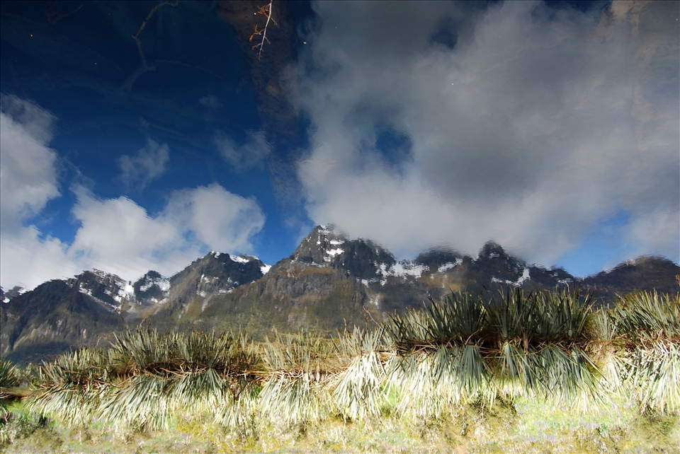 Inverse view of the highest mountains reflected in the lowest lake.