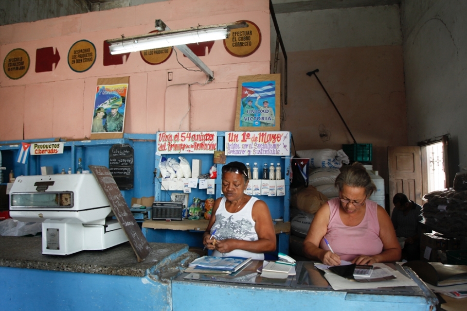 Havana, Cuba. Employees at a common Cuban store are checking the inventory on a Saturday morning. Most of the basic food staples are subsidised but come in strict quotas for each Cuban.
