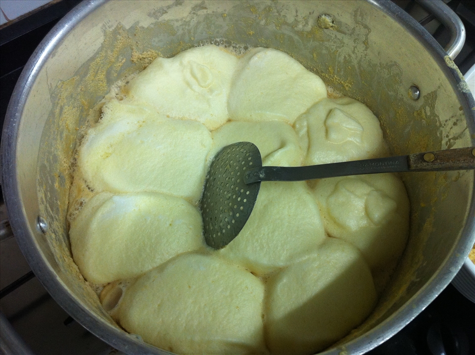 Sweet milk's surface full of little egg clouds.