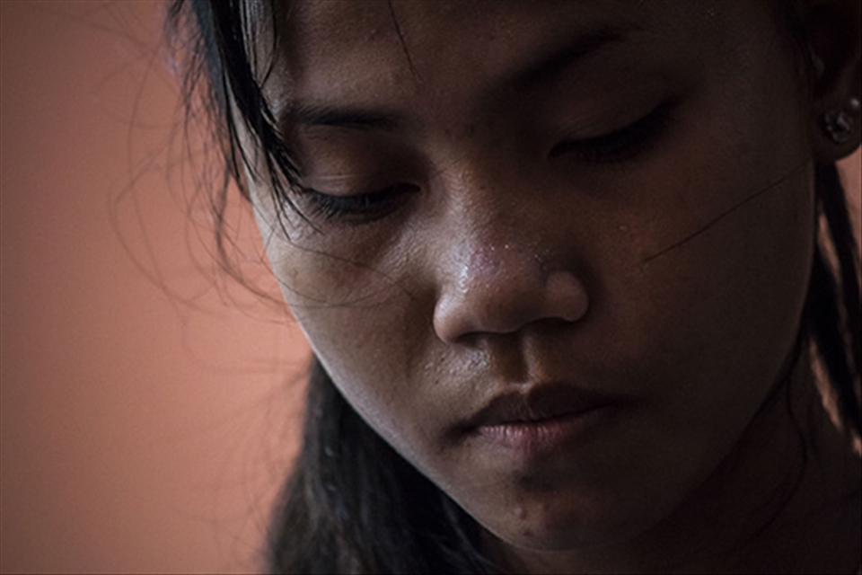 A young teen gathers herself after a harsh practice of traditional dance