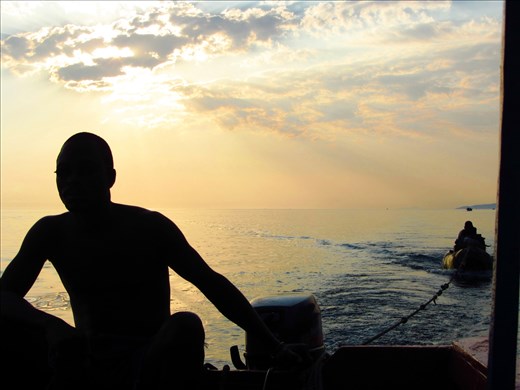 Fishermen coming back with fresh fish the day after