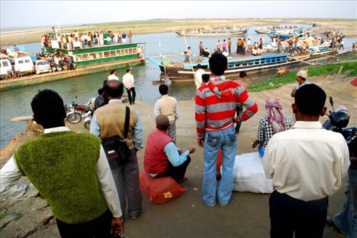 People waiting here in the Nimanti ghat, the river port of Majuli river island. Majuli river island is the cultural capital and the cradle of Assamese civilization for the past five hundred years.The satras set up preserve antiques like weapons, utensils, jewellery and other items of cultural significance.The island has been the hub of Assamese neo-Vaishnavite culture, initiated around 15th century by the revered Assamese saint Srimanta Sankardeva and his disciple Madhavdeva. Many Xatras or monasteries constructed by the saint still survive and represent the colourful Assamese culture.
