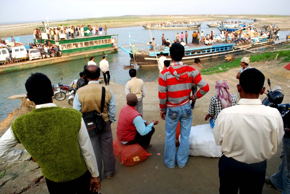 People waiting here in the Nimanti ghat, the river port of Majuli river island. Majuli river island is the cultural capital and the cradle of Assamese civilization for the past five hundred years.The satras set up preserve antiques like weapons, utensils, jewellery and other items of cultural significance.The island has been the hub of Assamese neo-Vaishnavite culture, initiated around 15th century by the revered Assamese saint Srimanta Sankardeva and his disciple Madhavdeva. Many Xatras or monasteries constructed by the saint still survive and represent the colourful Assamese culture.