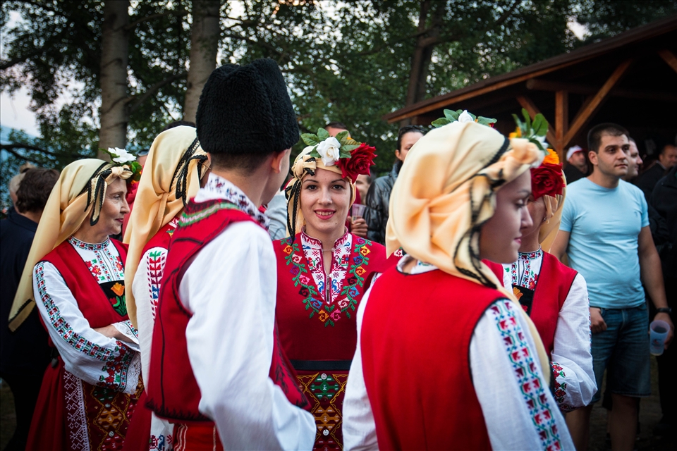 Welcome to Bulgaria, the land of roses! This is the annual Folk Festival at the village of Gela. Dancers are getting ready for their performance.