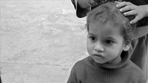 One of the many children fascinated by the presence of an Australian. It's not un common to have large groups of children gather around just to watch you.