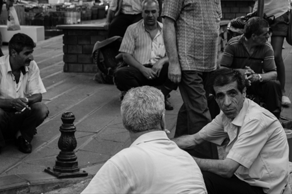 I was walking in Istanbul's streets and i saw a group of men walking, everybody with a bus-seat on the back. Then they stopped and sitted down in circle, somebody spoke, somebody only watched around. His gaze catch me