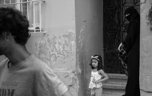 Finally i entered in the forgotten part of the city, and i meet what i searched: real people. My travelmate and i meet a group of children, playing football in the street. We asked to play, and so we began the best match of our life. But only at home, when i discovered this photo, i understood that.