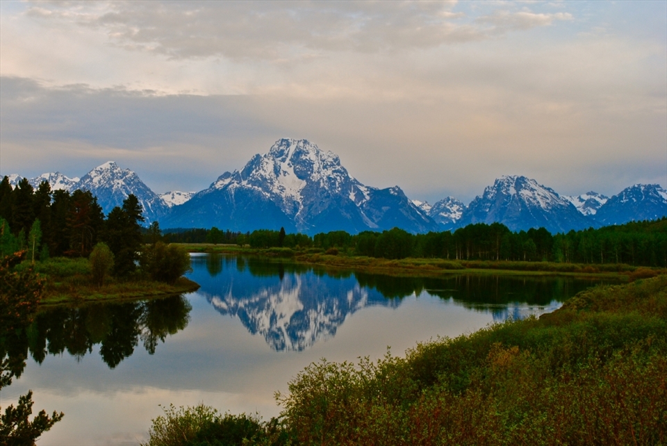 After traveling with my family to Yellowstone Nat'l Park, I had a great opportunity to use my new camera.  Mother Nature decided to make the park twice as alluring by reflecting the mountain's beauty in the lake.  I couldn't think of a better way or a more appropriate subject to break in my equipment. 