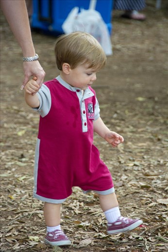 A child spilled all over his clothes, and mom took him away to change.