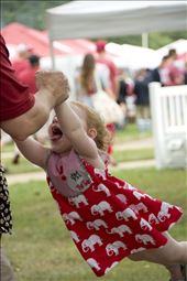 An enthusiastic father completely focused on swinging his daughter, laughing. : by coralindholm, Views[499]