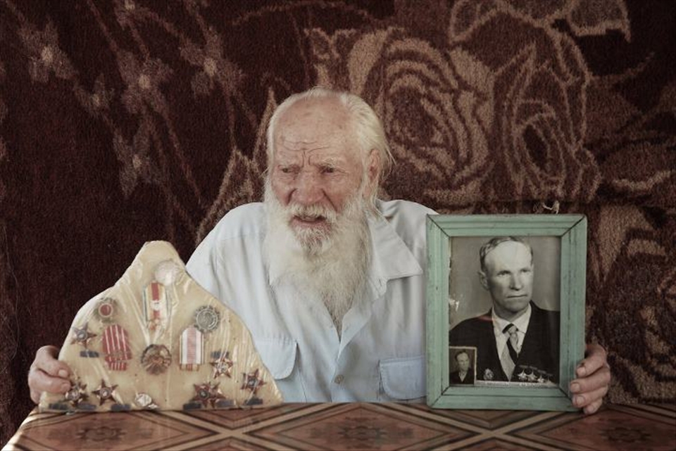 In a village where alcohol abuse and other afflictions fell many by middle-age, 94-year-old Haralambie stands out not only for longevity, but for a life of genuine achievement. In this photo he shows off medals awarded to him during the communist regime for being the top-producing fisherman of his community. Haralambie has grown an increasingly longer beard as he grew older – according to Lippovans’ customs, this is a requirement in order to be admitted to heaven.