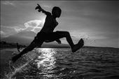 After the Nyepi Day, Bali, a kid washes the bad spirits by jumping in the water.: by costa, Views[258]
