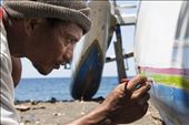 A Bali's fisherman focused on decorating his boat with the traditional colors.: by costa, Views[277]