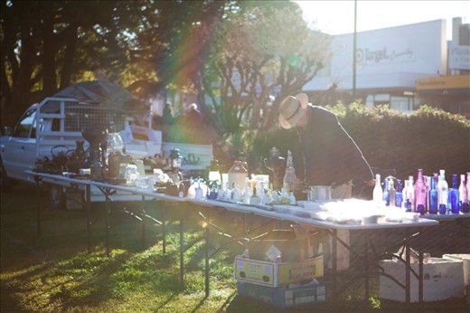 A lonely old man reaches for his seat to rest his weary legs. It's too early for buyers of his meagre wares, they would still be getting out of bed on this brisk morning.