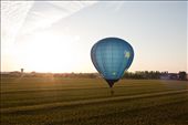 After completing the evening competition task, some balloons enjoy a leisurely evening flight. Here “Stellar” is still in a race to beat the setting sun. Flight elevation and landing zone restrictions can make it difficult to find a spot to land. Indianola, Iowa.: by cracibo, Views[388]