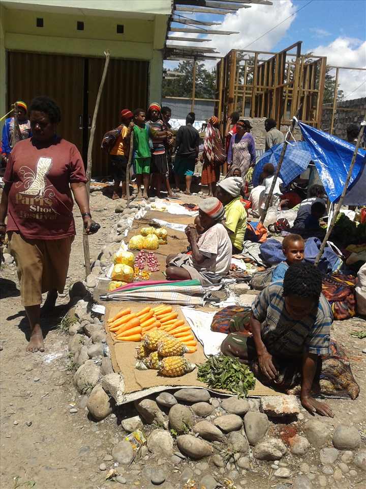 At the market, trading. 