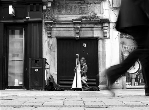 This girl usually plays the harp in the main street of Galway.