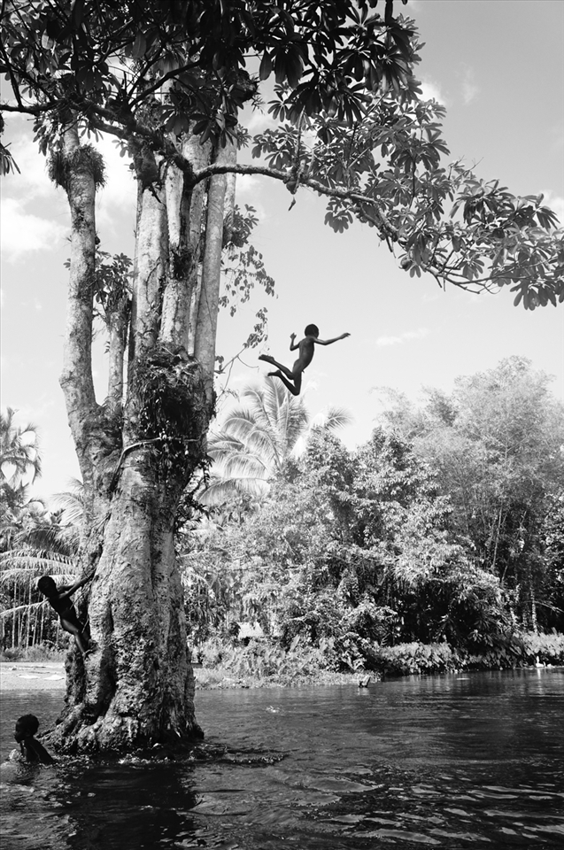 The river is a place to wash, swim and JUMP. Nangali Village.