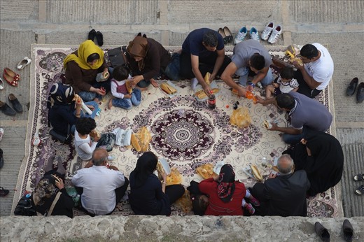 A family of tourists takes a break from sightseeing at Qu’ran gate in the southern city of Shiraz to enjoy a picnic on a traditional Persian rug. Shiraz is one of the most popular destinations for the local tourism during Nowruz, as it is the resting place of the venerated poets Hafiz and Saadi. Thousands flock to Shiraz to pay their respects every spring.