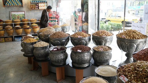 Nuts of every kind and size, along with sweets and dried fruits are offered to relatives and friends who visit each other on Nowruz. According to tradition, the youths visit the elders first, who in turn pay the visit later that same day. Here, a man compares prices at a delicacies store in Teheran. The economic sanctions that the Iranian economy faces have had a strong impact in the pocket of the people as the prices of special commodities such as nuts during Nowruz skyrocketed due to inflation.