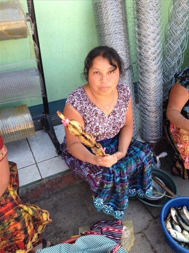Woman selling fish from the lake 