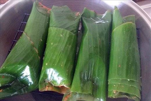 Pepesan Ikan parcels steaming in Wok