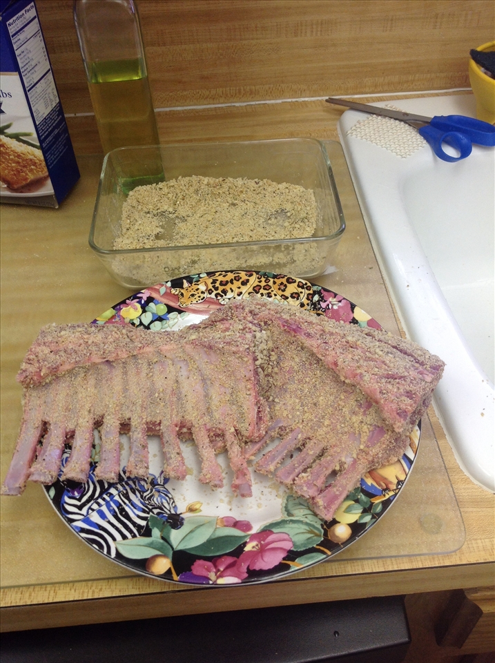 slathering ribs with bread crumbs and spices